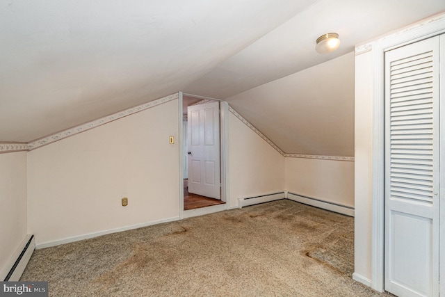 bonus room with carpet floors, a baseboard radiator, vaulted ceiling, and baseboards