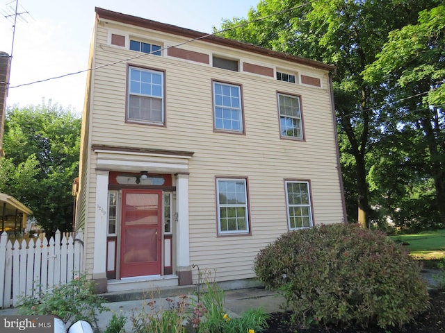 view of front of house with fence