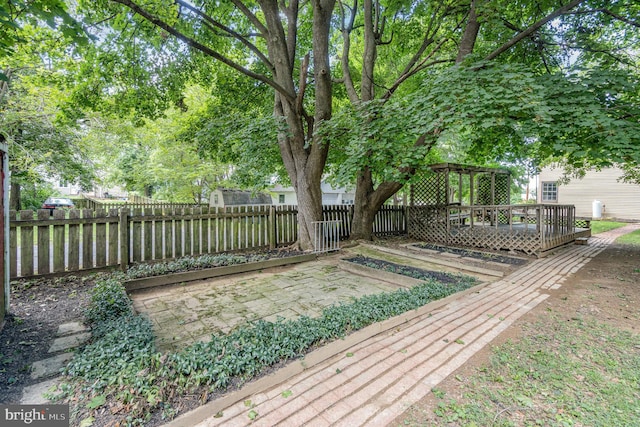 deck featuring fence and a gazebo