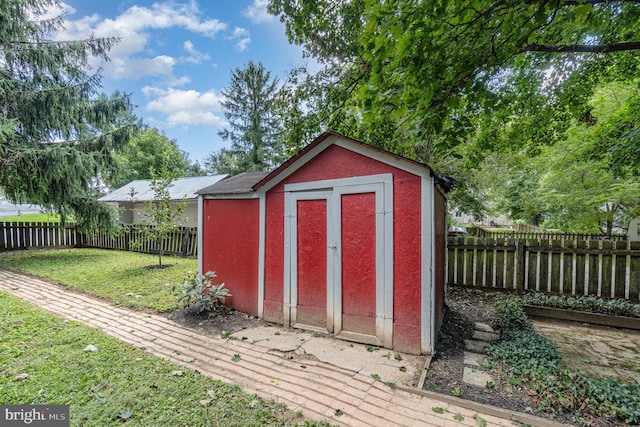 view of shed featuring a fenced backyard