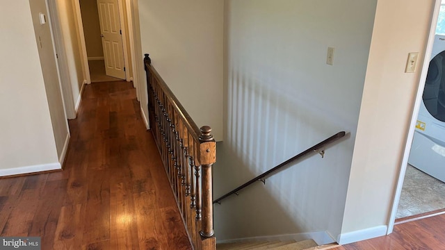 hallway with dark wood-type flooring