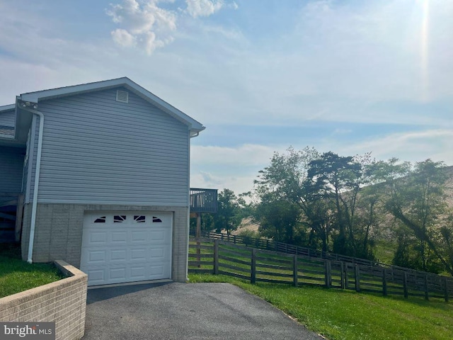 view of side of property featuring a garage