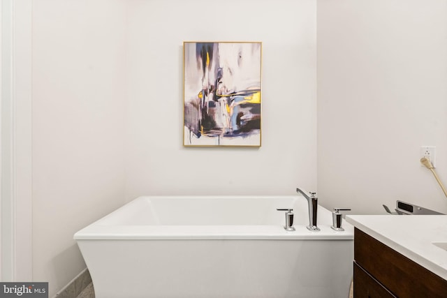 bathroom with vanity and a bathing tub