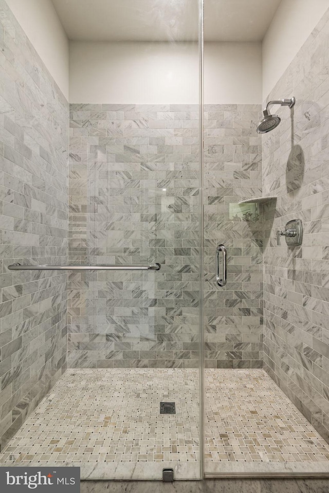 bathroom featuring an enclosed shower