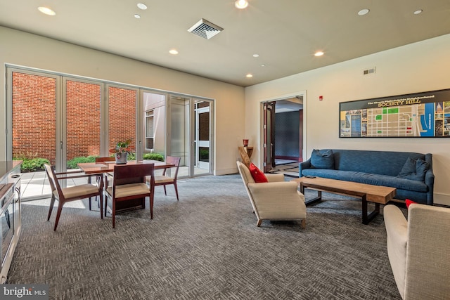 living room featuring dark carpet