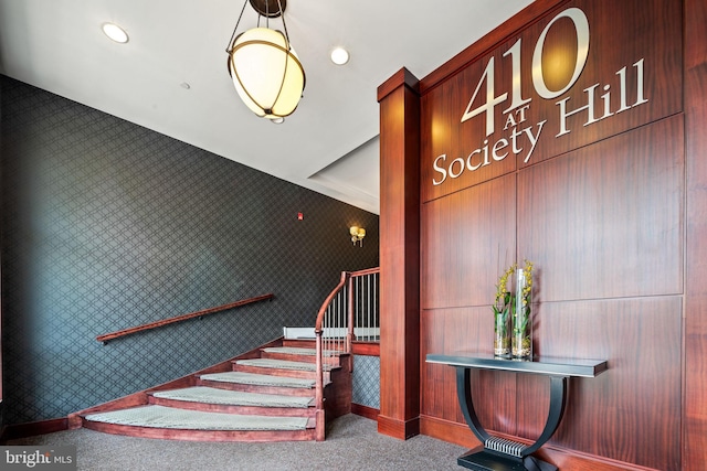 staircase with carpet floors