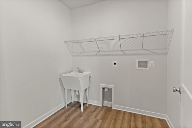 laundry room with washer hookup, hardwood / wood-style floors, and electric dryer hookup