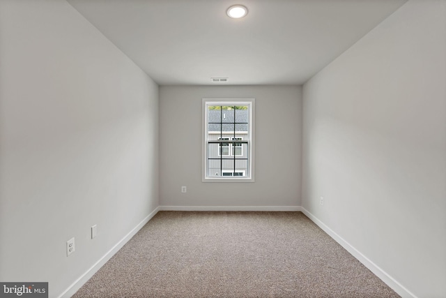 empty room featuring carpet floors