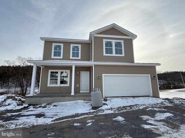 view of front facade featuring a garage and a porch