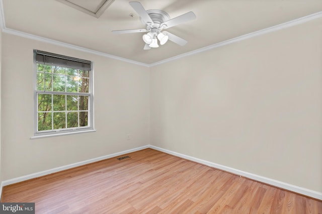 empty room featuring light hardwood / wood-style flooring, ceiling fan, and ornamental molding