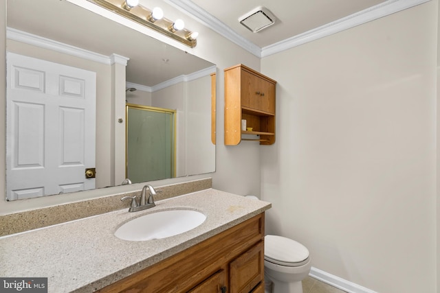 bathroom featuring tile patterned floors, ornamental molding, vanity, toilet, and a shower with shower door