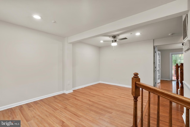 unfurnished room with ceiling fan and light hardwood / wood-style floors