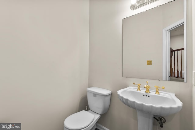 bathroom with sink and toilet