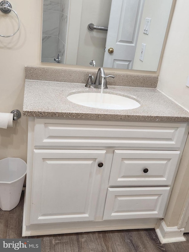 bathroom featuring hardwood / wood-style floors and vanity