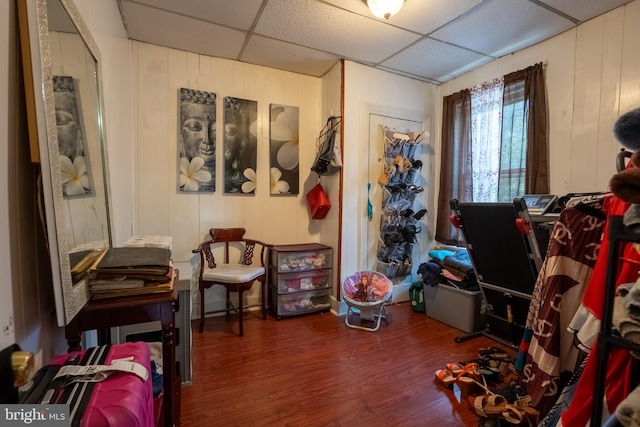 misc room with hardwood / wood-style flooring and a drop ceiling