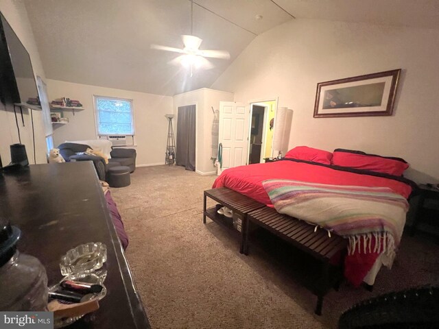 bedroom with vaulted ceiling, carpet floors, and ceiling fan