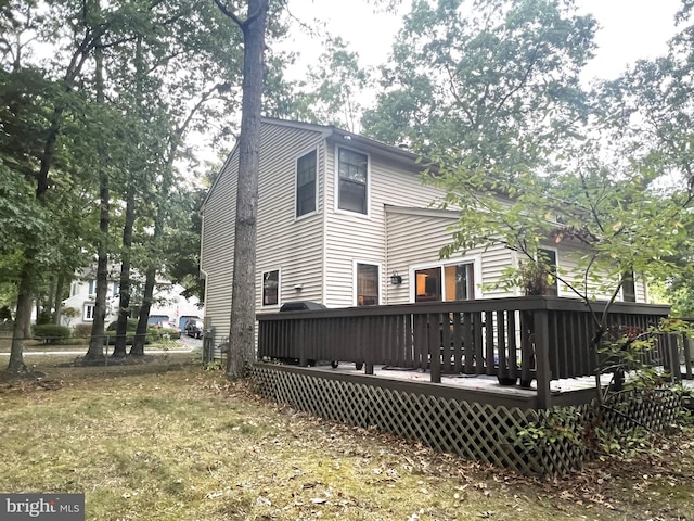 back of property featuring a deck