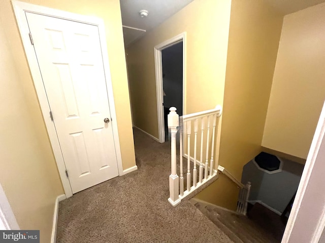 hallway with dark carpet