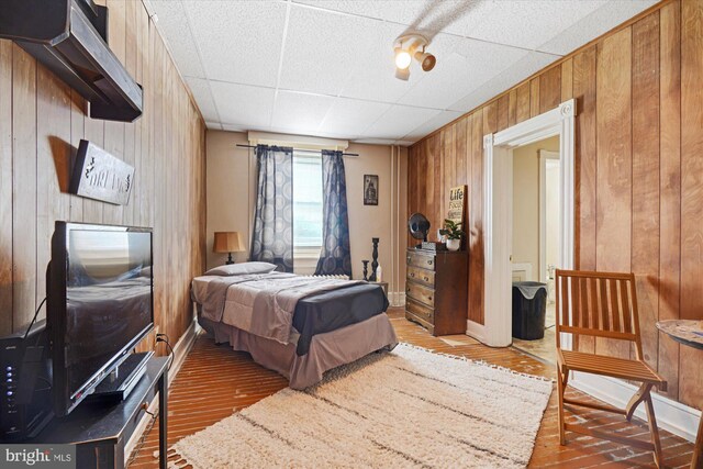 game room with crown molding, pool table, wood-type flooring, radiator, and a chandelier