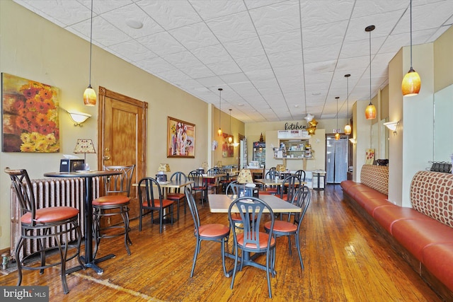 dining area with hardwood / wood-style floors