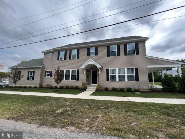 view of front of home featuring a front yard