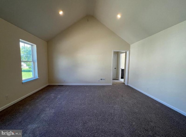 interior space with baseboards and high vaulted ceiling