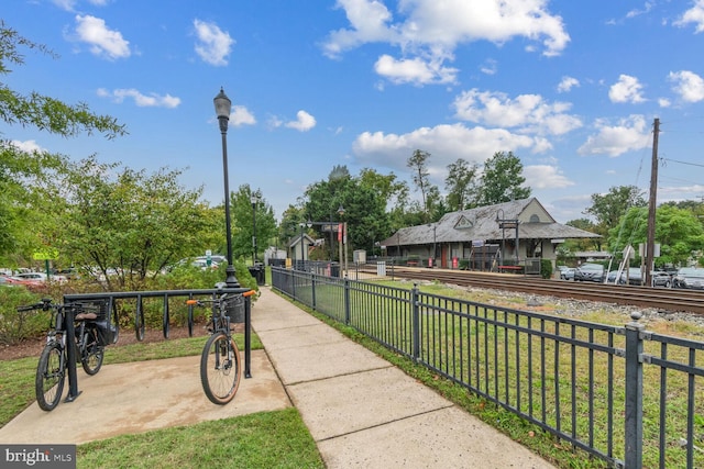 view of property's community with a yard