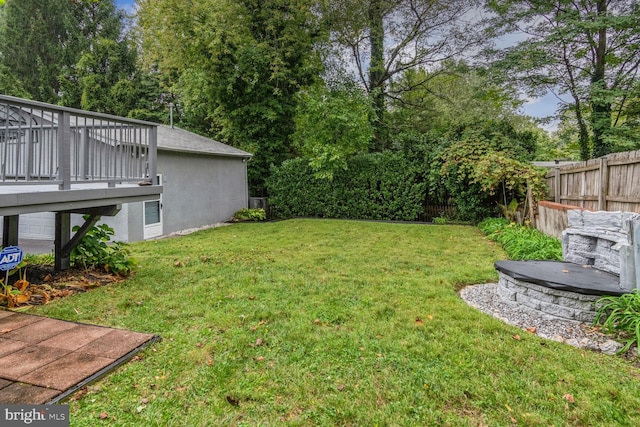 view of yard with a wooden deck