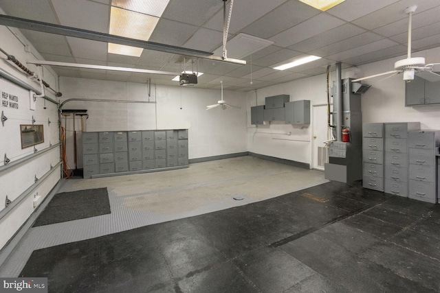 garage featuring a garage door opener and ceiling fan