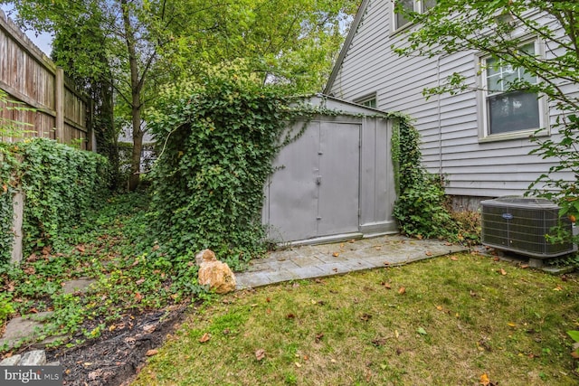 exterior space featuring a lawn and cooling unit