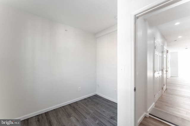 hallway featuring dark wood-type flooring