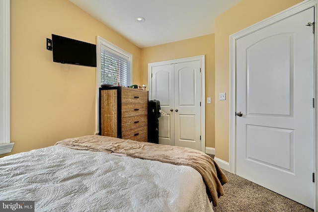 bedroom featuring a closet and carpet