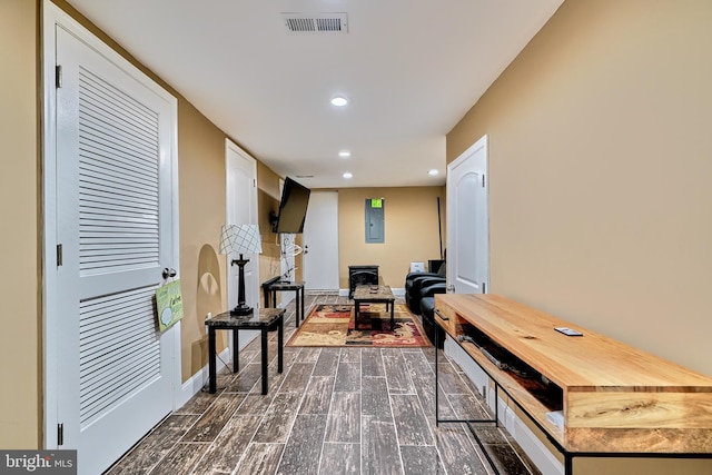 sitting room featuring dark wood-type flooring