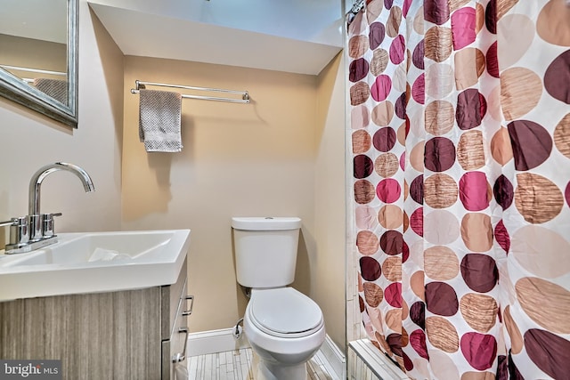 bathroom with vanity, hardwood / wood-style flooring, toilet, and a shower with shower curtain