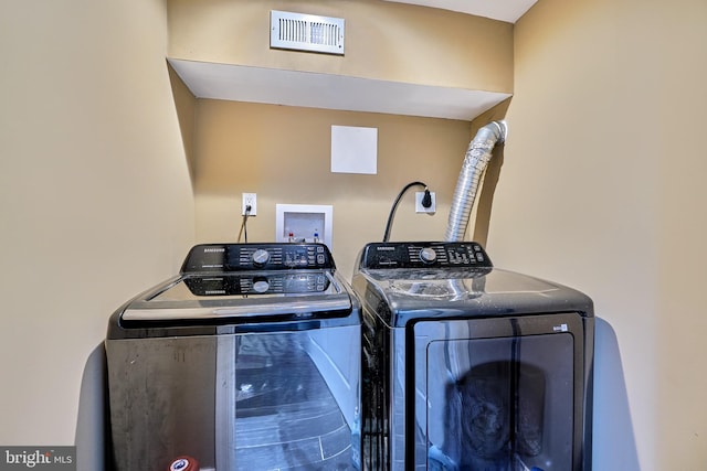 clothes washing area featuring washing machine and clothes dryer