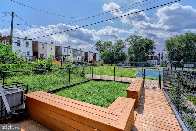 exterior space featuring central AC and a yard