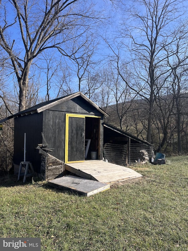 view of outdoor structure with a lawn