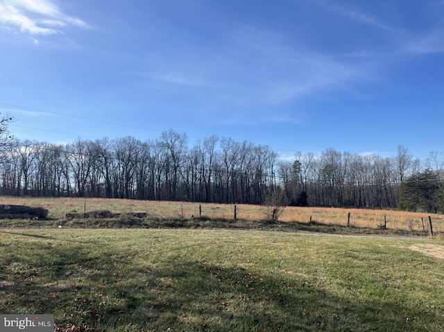 view of yard with a rural view