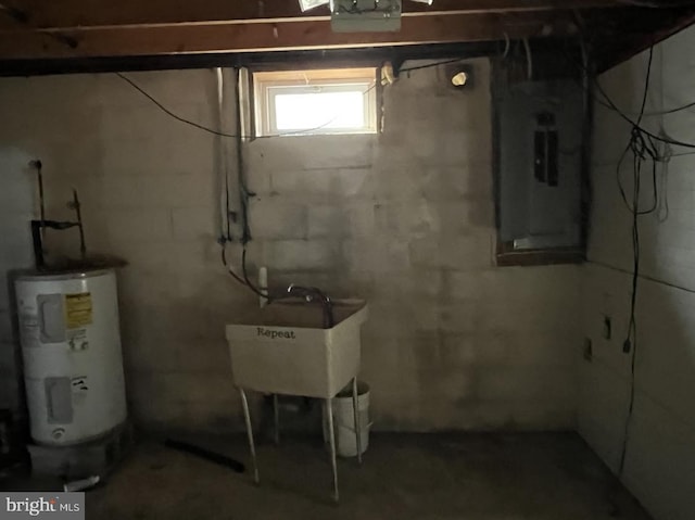 basement with electric water heater, electric panel, and sink