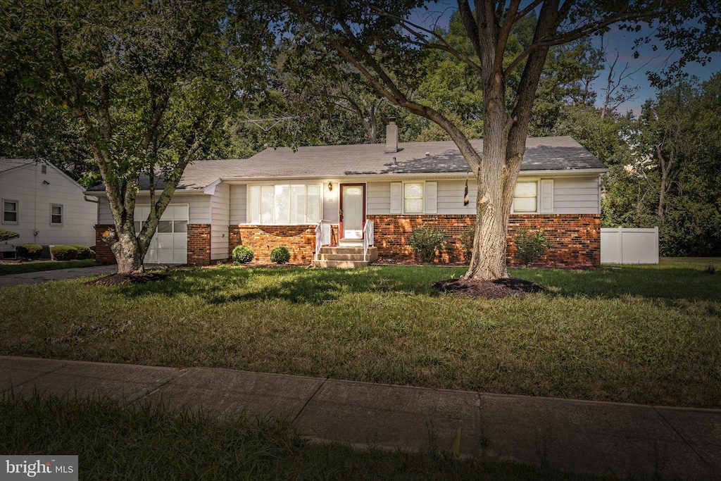 view of front of home with a front yard