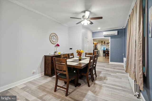 dining space featuring ceiling fan, light hardwood / wood-style flooring, a wall unit AC, and crown molding