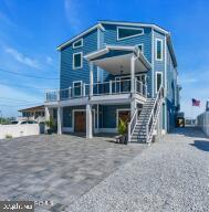 view of front of property with a balcony and a garage