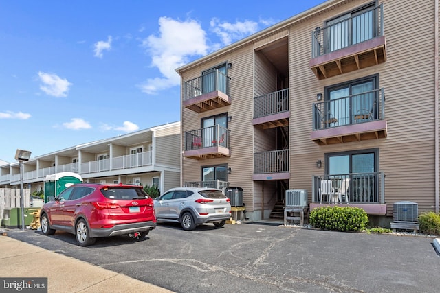 500 32nd St Unit A, Ocean City, MD 21842 - view of apartment building / complex featuring central AC and uncovered parking
