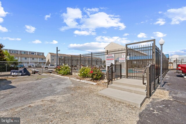 500 32nd St Unit A, Ocean City, MD 21842 - view of home's community with fence and uncovered parking
