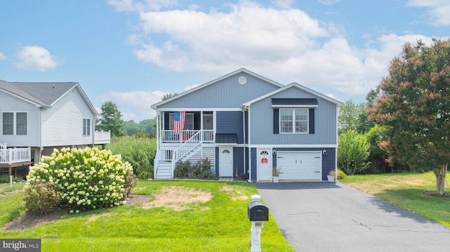 view of front of house with a garage and a front lawn