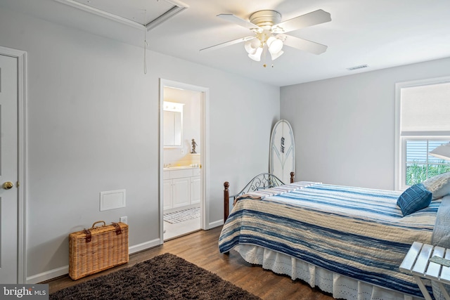 bedroom with hardwood / wood-style flooring, ensuite bath, and ceiling fan