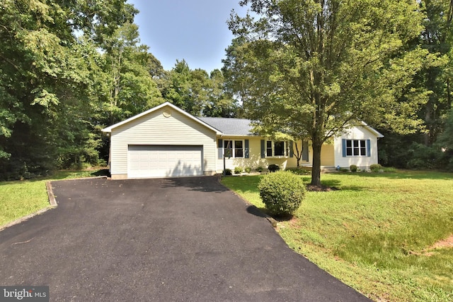 ranch-style house featuring aphalt driveway, a front yard, and a garage