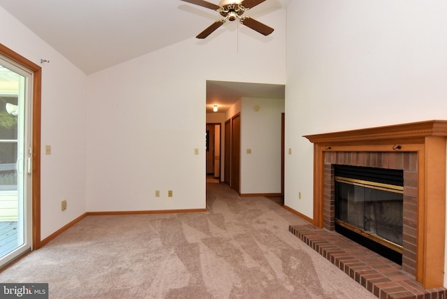 unfurnished living room with a fireplace, carpet flooring, vaulted ceiling, and ceiling fan