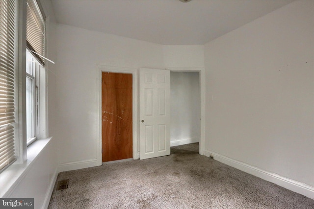 unfurnished bedroom featuring carpet floors