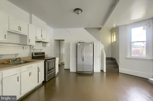 kitchen featuring white cabinetry, appliances with stainless steel finishes, and sink